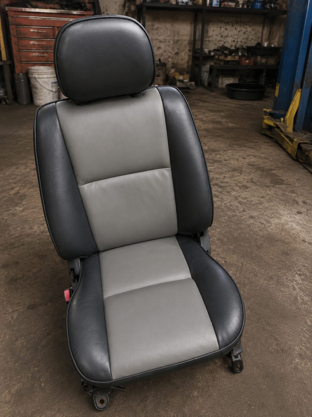 Grey and black seat rebuilt from a worn original