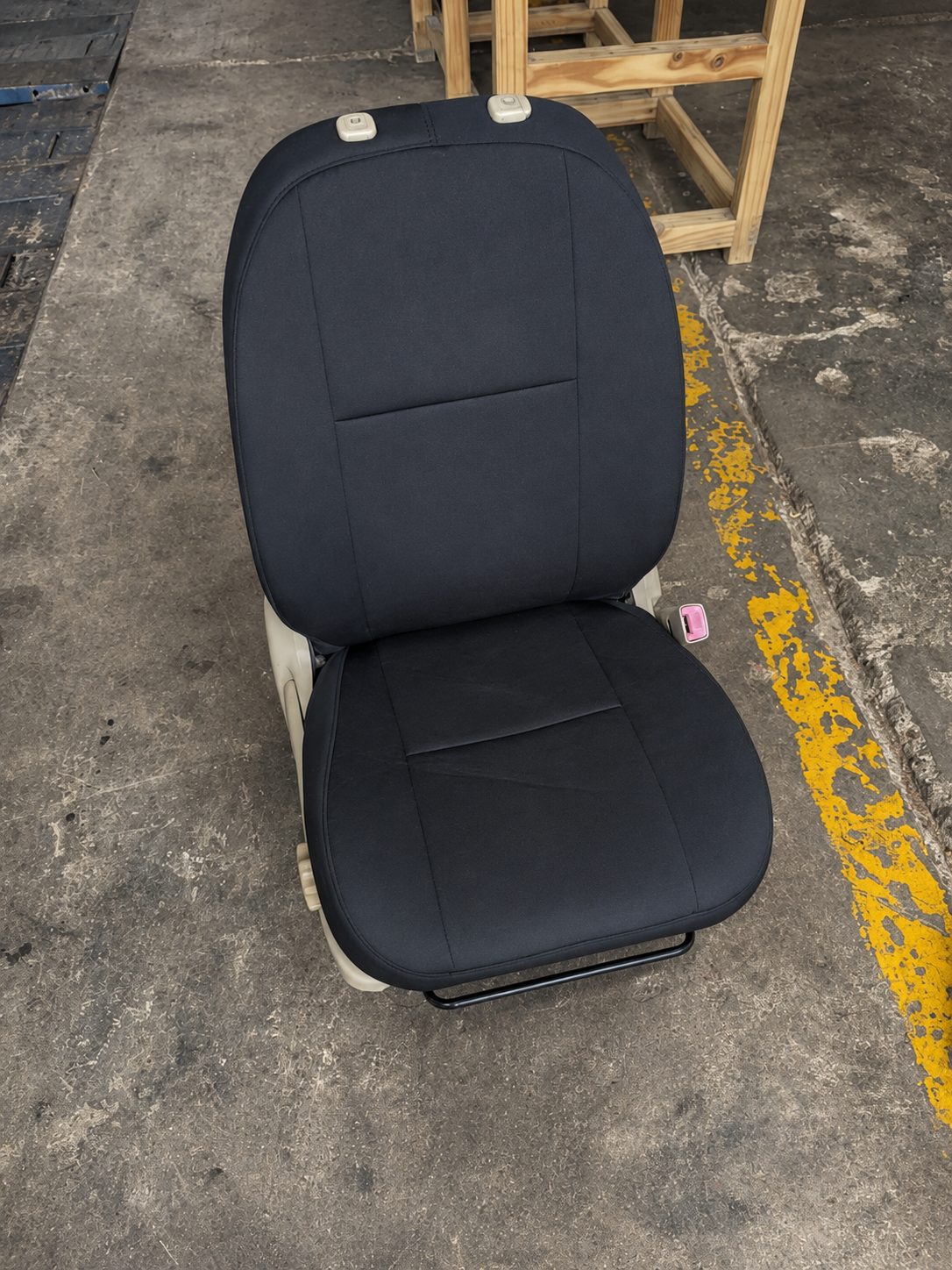 The same seat rebuilt in hard-wearing black fabric