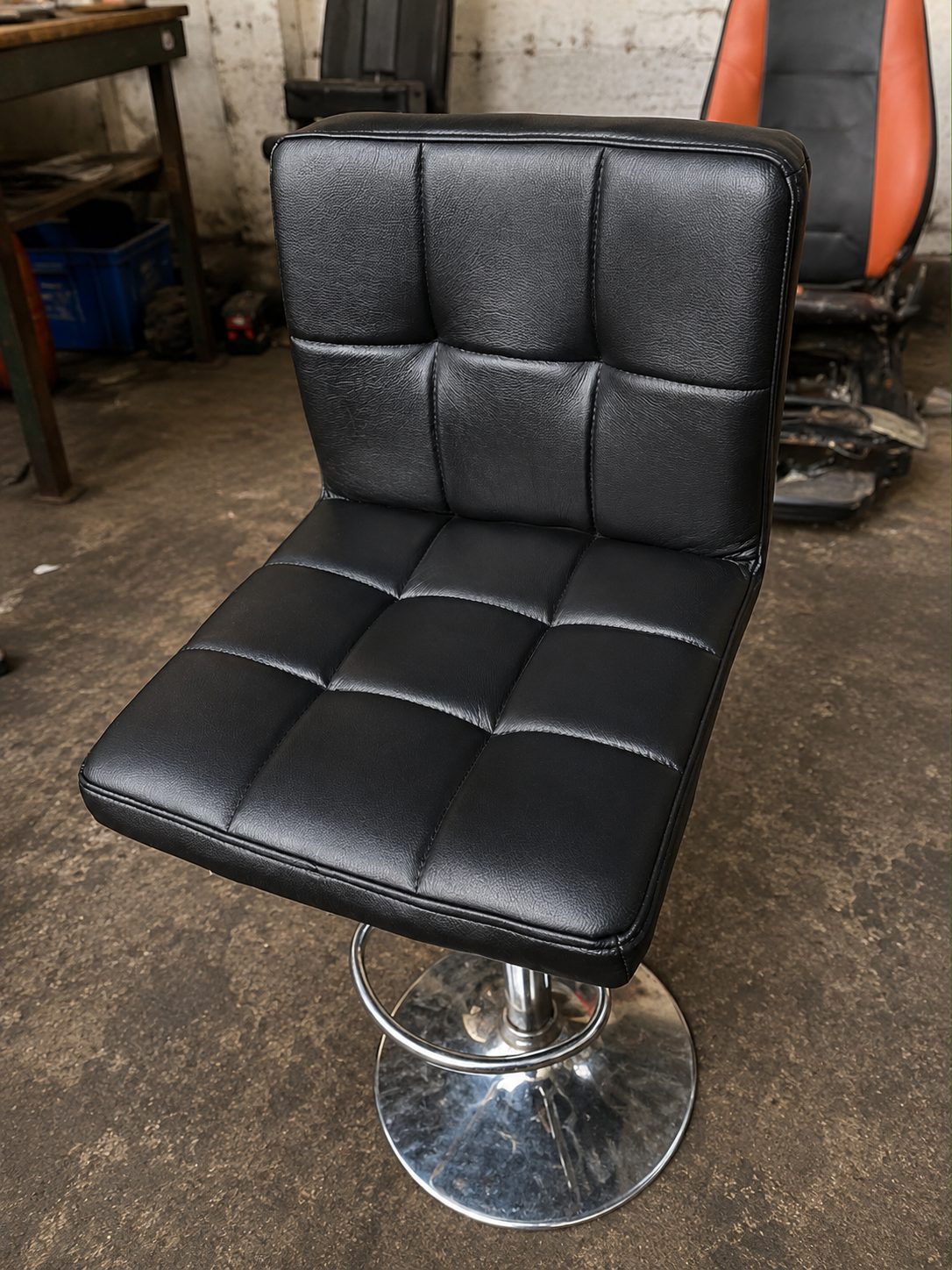 Black tufted vinyl bar stool re-upholstered