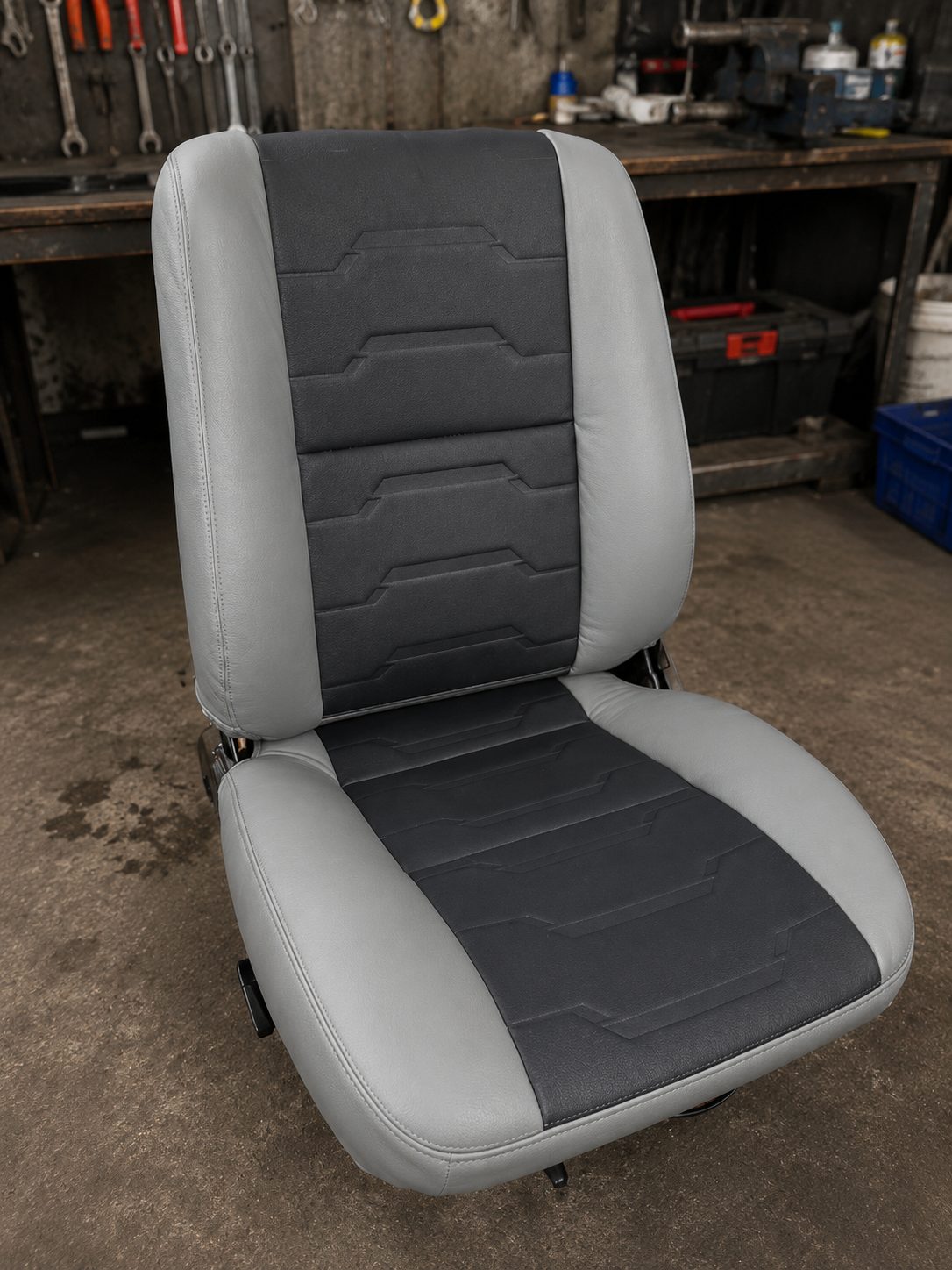 Grey seat with embossed black centre panel